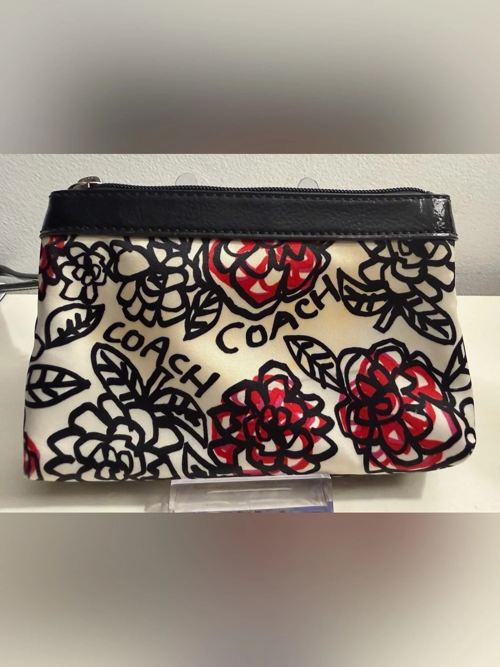 Coach Poppy Daisy Floral Graffiti wristlet.